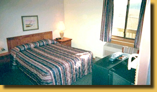 An image of a motel room's fridge area